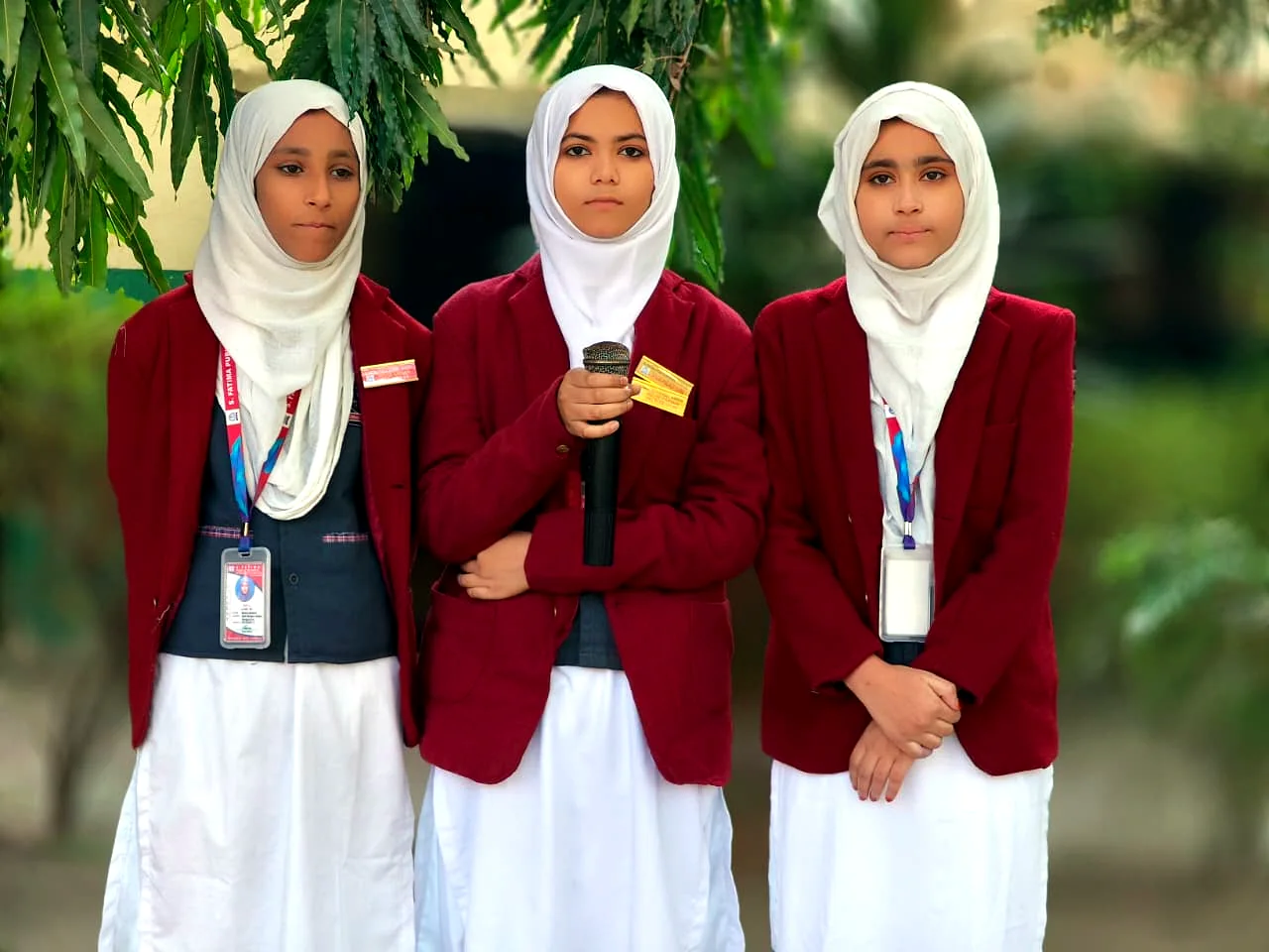 Students holding an award together at school.