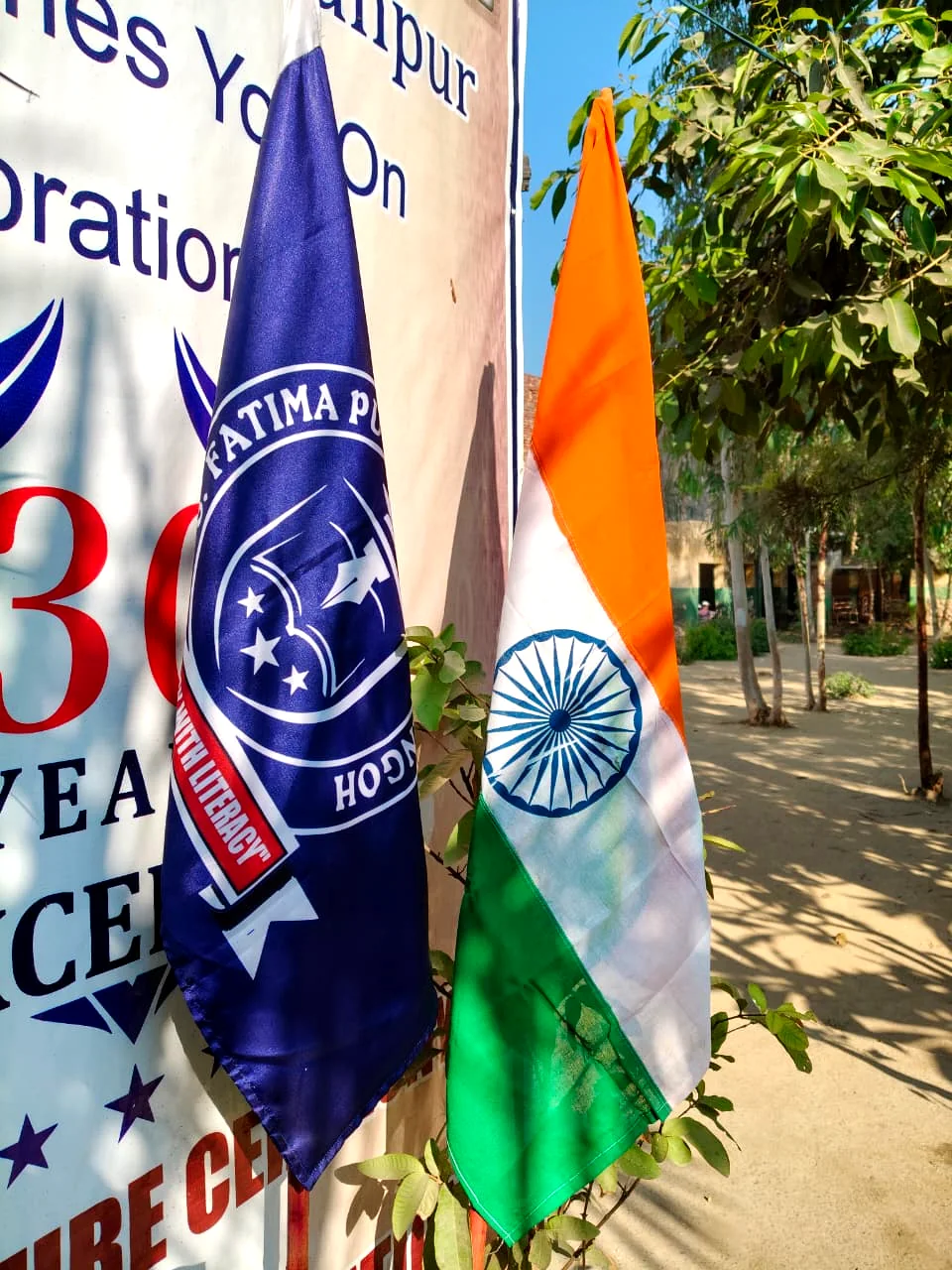 School flags and event materials from a student programme.