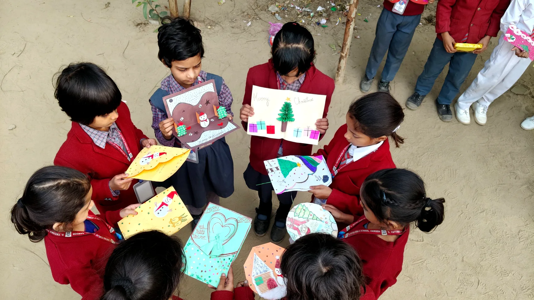 Children working together on creative projects, seen from above.