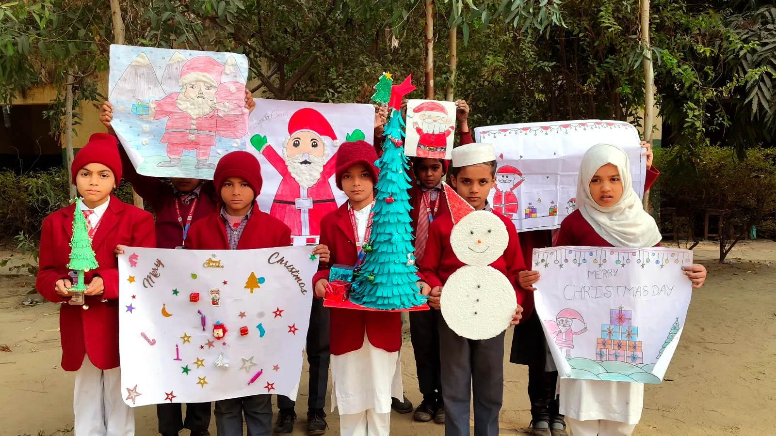 Students presenting handmade charts and creative projects.