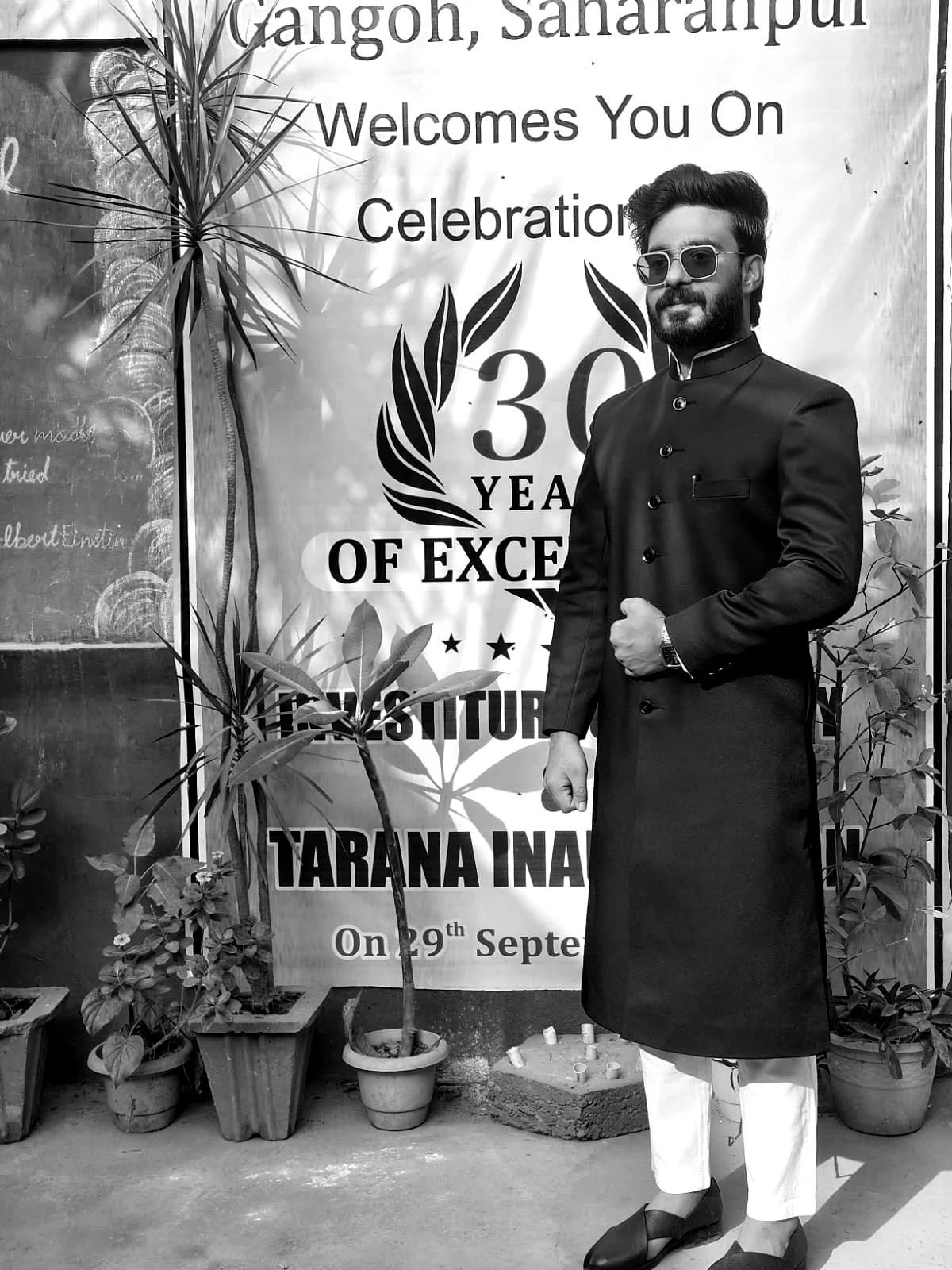 A speaker at a school commemorative gathering.