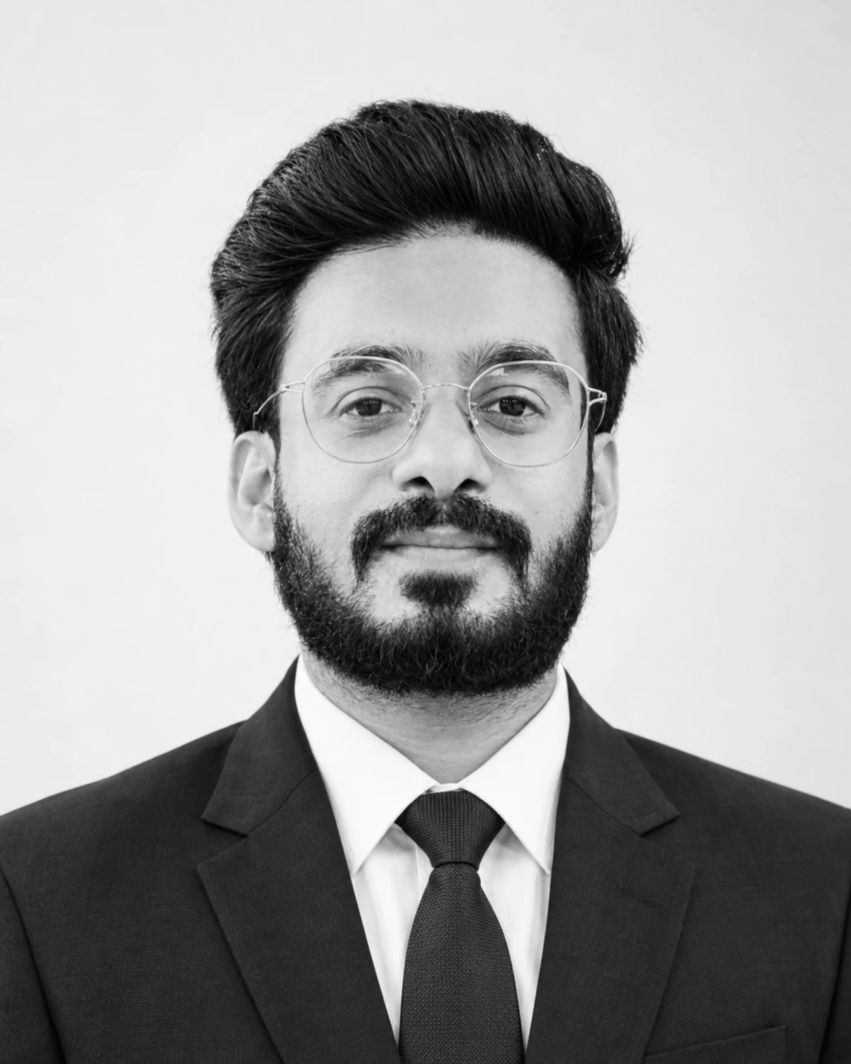 Aaqib Javed, Principal and Director of Academics and International Engagement at S. Fatima Public School, in a professional black-and-white portrait.