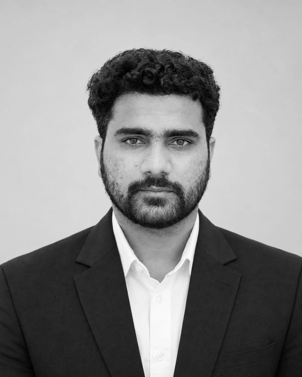 Anas Malik, Mathematics and Science Teacher at S. Fatima Public School, in a centered professional black-and-white headshot.